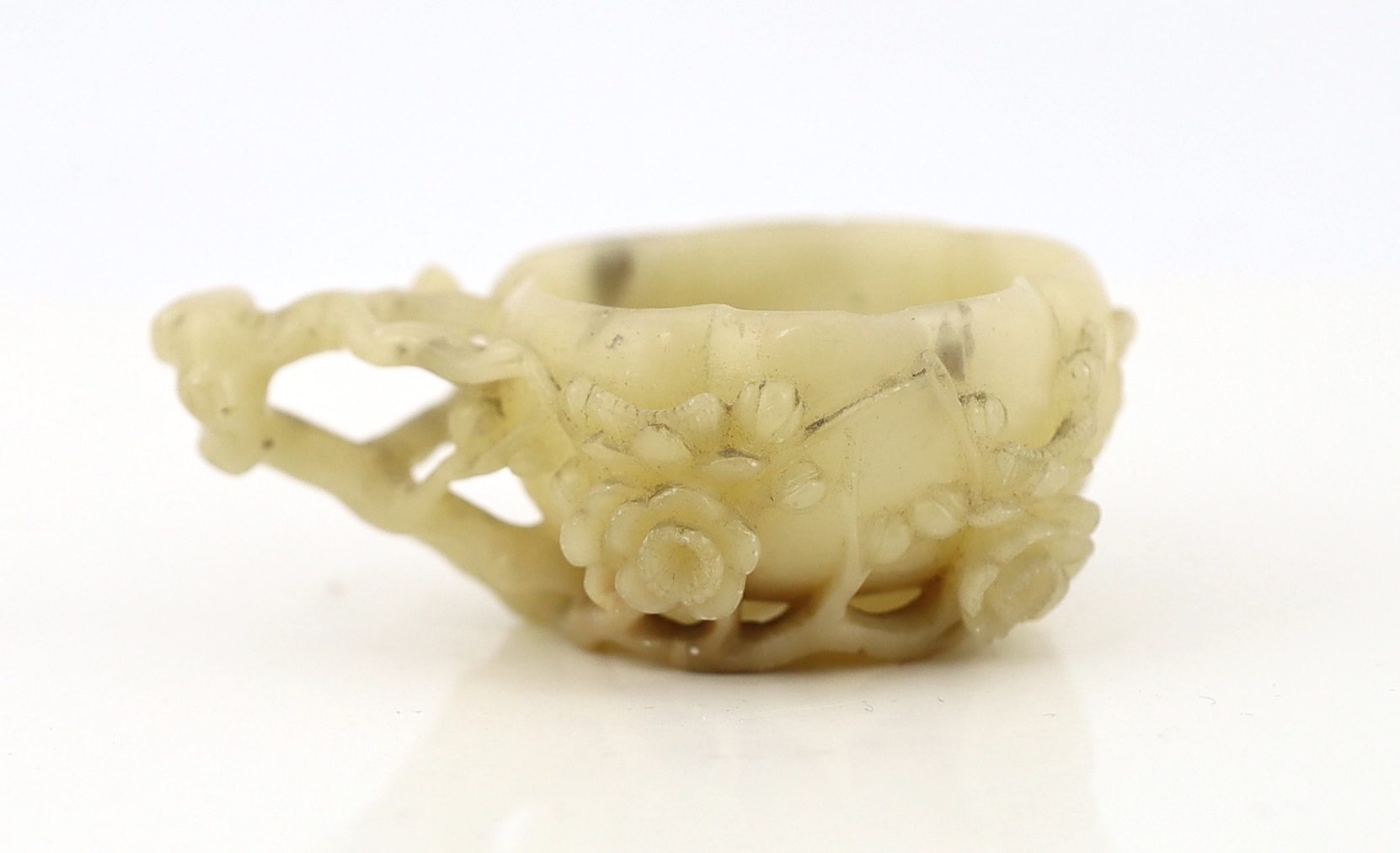 CORRECTION: A Chinese creamy white soapstone NOT jade ‘plum blossom’ cup, 18th/19th century